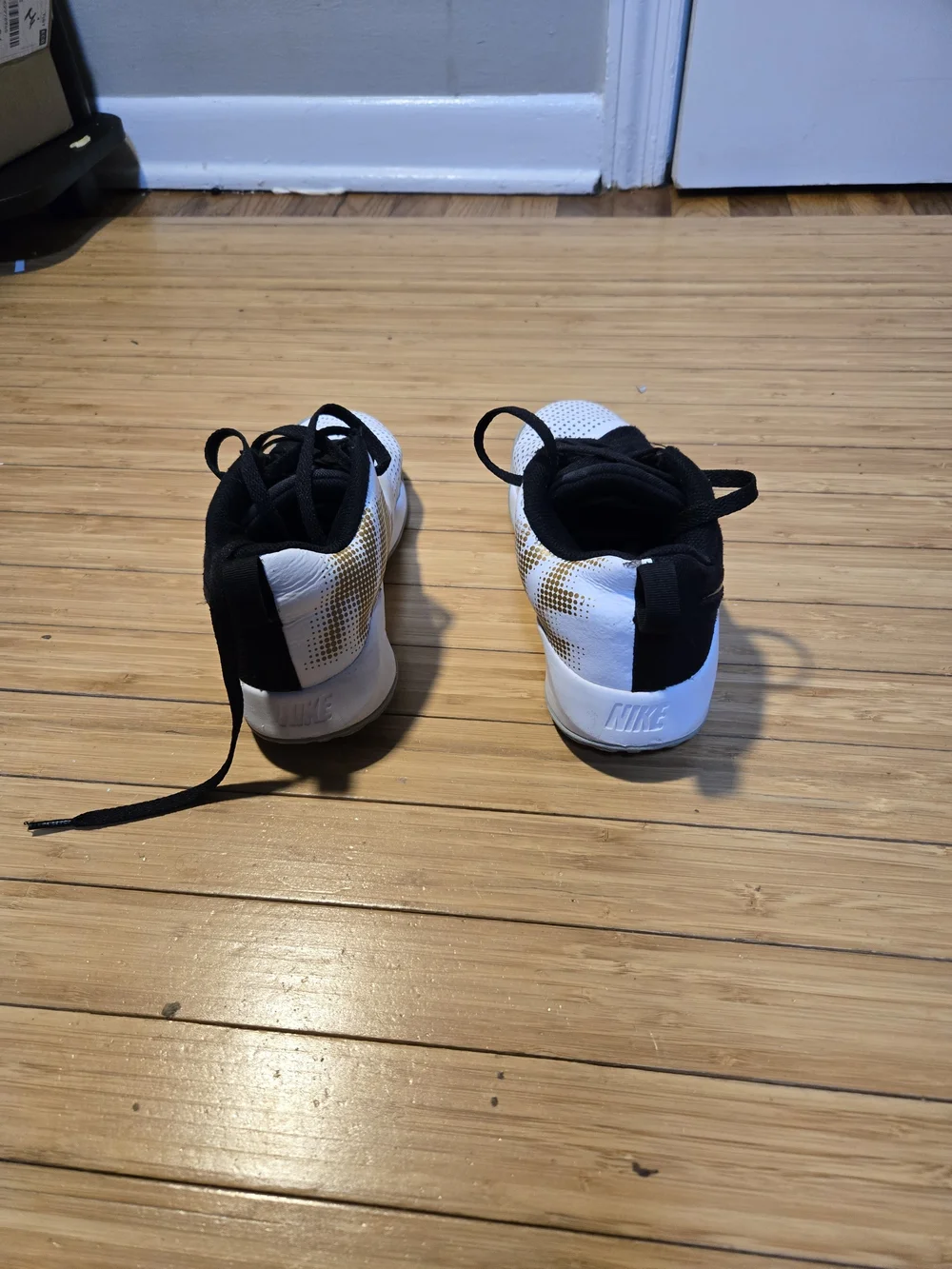 Nike Boy Black and White Basketball Shoes with Gold Accents